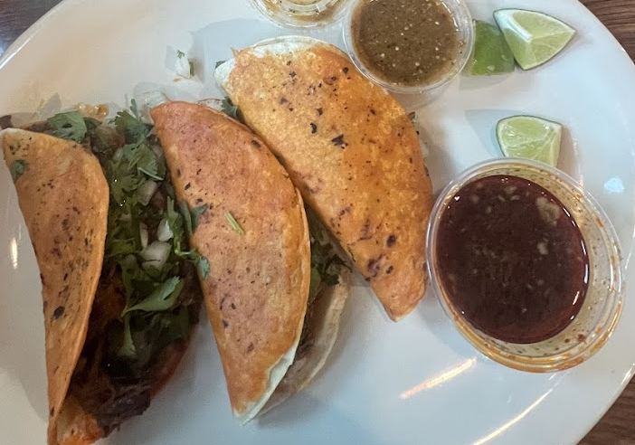 Bariachi Mexican Kitchen signature dishes Birria TacosQuesoChicken on Rice